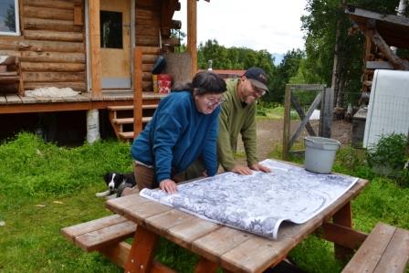 Fran and Pete check out the Beehive Collective Poster
